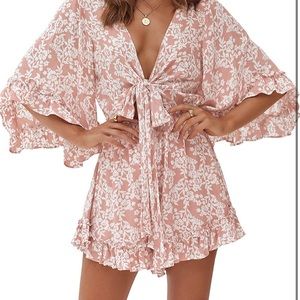 Brand new romper floral with out tags.